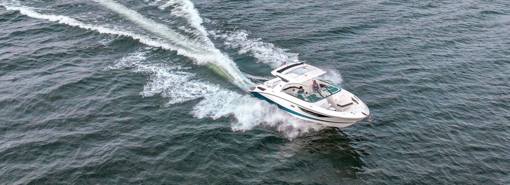 a boat on the water for Mau Marine in Okoboji Iowa